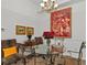 Charming dining area featuring a glass table and ornate chandelier at 5134 Northridge Rd # 303, Sarasota, FL 34238