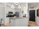 Bright kitchen with granite countertops and stainless steel appliances at 5134 Northridge Rd # 303, Sarasota, FL 34238