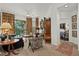 Cozy living room with stylish furnishings and a screened balcony at 5134 Northridge Rd # 303, Sarasota, FL 34238