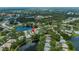 Aerial view of a neighborhood with ponds and lush greenery, marked with a pin at 519 Catalina Isles Cir, Venice, FL 34292