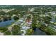 Aerial view of a neighborhood with ponds and lush greenery, marked with a pin at 519 Catalina Isles Cir, Venice, FL 34292