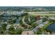 Aerial view showcasing community amenities including a pool, shuffleboard, and tennis courts at 519 Catalina Isles Cir, Venice, FL 34292