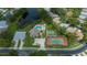 Aerial view showcasing community amenities including a pool, shuffleboard, and tennis courts at 519 Catalina Isles Cir, Venice, FL 34292