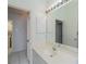 Bathroom vanity area with large mirror and white cabinets at 519 Catalina Isles Cir, Venice, FL 34292
