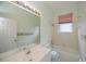 Bathroom features a tub with shower and a large mirror at 519 Catalina Isles Cir, Venice, FL 34292