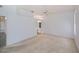 Carpeted bedroom, ceiling fan and an en suite bathroom at 519 Catalina Isles Cir, Venice, FL 34292