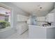 Bright kitchen with white cabinets and lots of counterspace, plus an adjacent view to dining area at 519 Catalina Isles Cir, Venice, FL 34292