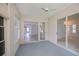 Enclosed lanai with sliding glass doors and ceiling fan, great for relaxing or entertaining guests at 519 Catalina Isles Cir, Venice, FL 34292