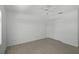 Spacious bedroom with tiled floors, ceiling fan, and closet space at 5306 Maccaughey Dr, North Port, FL 34287