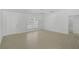 A bright bedroom with tile floors, white walls, a window, and a ceiling fan at 5306 Maccaughey Dr, North Port, FL 34287