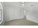 Clean bedroom with a ceiling fan, closet, and neutral-toned tile flooring at 5306 Maccaughey Dr, North Port, FL 34287