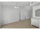 A spacious dining room with tile floors, white walls, with views to other rooms in the house at 5306 Maccaughey Dr, North Port, FL 34287