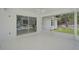 Screened lanai with sliding glass doors leading to pool and outdoor living space at 5306 Maccaughey Dr, North Port, FL 34287