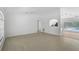 Open living room with tile floors, white walls, with views to other rooms in the house at 5306 Maccaughey Dr, North Port, FL 34287