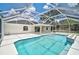 The pool has a screen enclosure and tiled trim at 5306 Maccaughey Dr, North Port, FL 34287