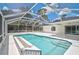 Sparkling pool with screened enclosure, providing a private backyard retreat at 5306 Maccaughey Dr, North Port, FL 34287