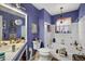 Unique bathroom with blue walls, vintage fixtures, and a shower-tub combo at 5369 Shadow Lawn Dr, Sarasota, FL 34242