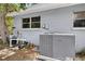 Exterior shot highlighting the modern AC unit and pool filtration system on the side of the house at 5369 Shadow Lawn Dr, Sarasota, FL 34242