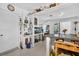 Open kitchen area with vintage countertop and seamless access to dining and living areas at 5369 Shadow Lawn Dr, Sarasota, FL 34242