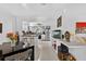 Bright and airy kitchen and dining area with stainless steel appliances and a stylish breakfast bar at 5369 Shadow Lawn Dr, Sarasota, FL 34242