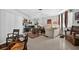 Well-lit living area with classic decor, patterned rugs, and a cozy ambiance for relaxing and entertaining at 5369 Shadow Lawn Dr, Sarasota, FL 34242