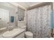 Well-maintained bathroom with a shower and tub combination with a tiled backsplash at 5818 Harrison Rd, Venice, FL 34293