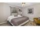 Comfortable bedroom featuring neutral walls, wood floors, and a side chair at 5818 Harrison Rd, Venice, FL 34293