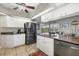 Bright kitchen featuring updated appliances, granite countertops, and a view of the backyard through the window at 5818 Harrison Rd, Venice, FL 34293