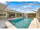 Inviting pool area with a screened enclosure, perfect for outdoor entertaining at 5818 Harrison Rd, Venice, FL 34293