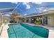Beautiful pool area with a screened enclosure and a sunny patio for relaxation at 5818 Harrison Rd, Venice, FL 34293