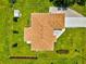 Aerial view shows a spacious backyard, well maintained roof, and neat landscaping at 5954 Gottfried Ln, North Port, FL 34291