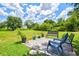 Outdoor patio seating area featuring a lovely view of the property with a large yard and a storage shed at 5954 Gottfried Ln, North Port, FL 34291
