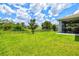 Backyard view with fenced in canal and storage shed with the screened patio attached to the home at 5954 Gottfried Ln, North Port, FL 34291