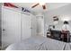 Relaxing bedroom features a large closet, a ceiling fan, and neutral colors perfect for a restful retreat at 5954 Gottfried Ln, North Port, FL 34291