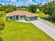 Charming single-story home featuring a well-manicured lawn, neutral paint, and an attached two-car garage at 5954 Gottfried Ln, North Port, FL 34291