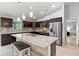 Bright kitchen features stainless steel appliances, granite countertops, and breakfast bar with seating at 5954 Gottfried Ln, North Port, FL 34291