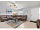 Living room featuring a large sectional couch and direct access to the front door at 5954 Gottfried Ln, North Port, FL 34291