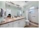 Bathroom with a large mirror, shower stall, and a view of another room through the doorway at 612 Bayshore Rd, Nokomis, FL 34275