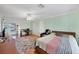Bedroom featuring light walls, ceiling fan, wood floors, and a sliding glass door to the outside at 612 Bayshore Rd, Nokomis, FL 34275