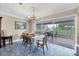 Comfortable dining room featuring seating for six and view to outdoor seating area at 612 Bayshore Rd, Nokomis, FL 34275