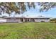 Charming single-story home featuring a metal roof, well-manicured lawn, and inviting curb appeal at 612 Bayshore Rd, Nokomis, FL 34275