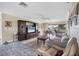 Open-concept living room with view into dining area, tile floors, and natural light at 612 Bayshore Rd, Nokomis, FL 34275
