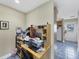 Functional office space with desk and storage solutions, connected to the kitchen area at 612 Bayshore Rd, Nokomis, FL 34275