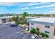 Aerial view of Antigua complex highlighting the well-maintained landscaping, parking, and building exteriors on a sunny day at 614 Guild Dr # 10, Venice, FL 34285
