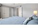 Bright bedroom features tile flooring, white walls, and a large window for plenty of natural light at 614 Guild Dr # 10, Venice, FL 34285