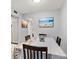 Bright dining room with tile floors, white walls, and a large window for plenty of natural light at 614 Guild Dr # 10, Venice, FL 34285