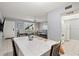 View of the dining area, looking towards the front door, the living area, and the kitchen at 614 Guild Dr # 10, Venice, FL 34285