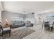 Open living space with tile flooring, neutral decor, and a dining area at 614 Guild Dr # 10, Venice, FL 34285