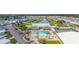 Aerial view of the community featuring a pool, clubhouse, marina, and tennis courts at 614 N Waterway, Venice, FL 34285