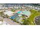 Stunning aerial view of community amenities including pool, tennis and shuffleboard courts, and recreation center at 614 N Waterway, Venice, FL 34285